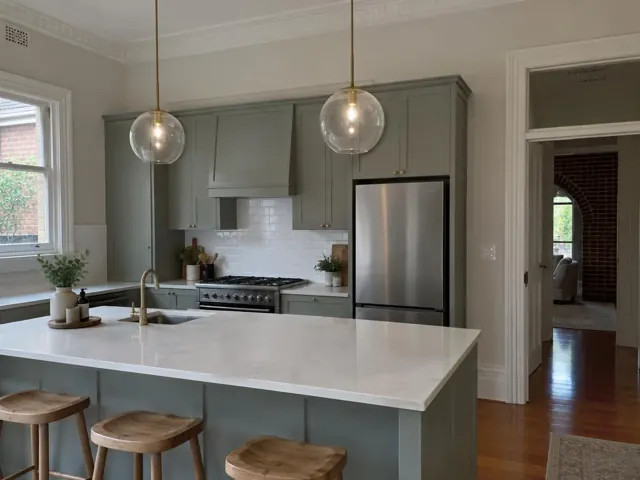 Two glass pendant lights over a kitchen island in a modern home in Jesmond